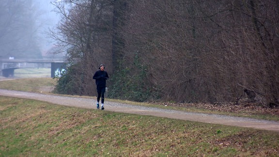 Jogger auf Laufweg.