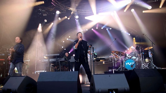 Rudi Buttas, Matthias Ulmer, Hartmut Engler und Frank Dapper von Pur live bei einem Konzert beim Summertime Norderney